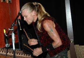 Malakai playing hammer dulcimer with Schindig